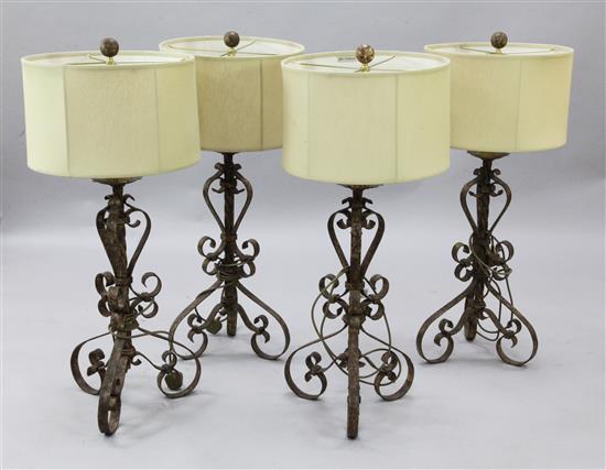 A set of four wrought iron table lamps, H.38in.